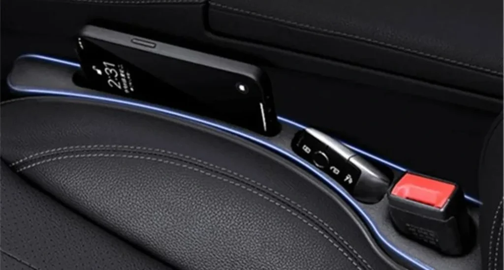 Phone resting safely in a car seat gap filled with a ChillguyBD PU leather gap filler